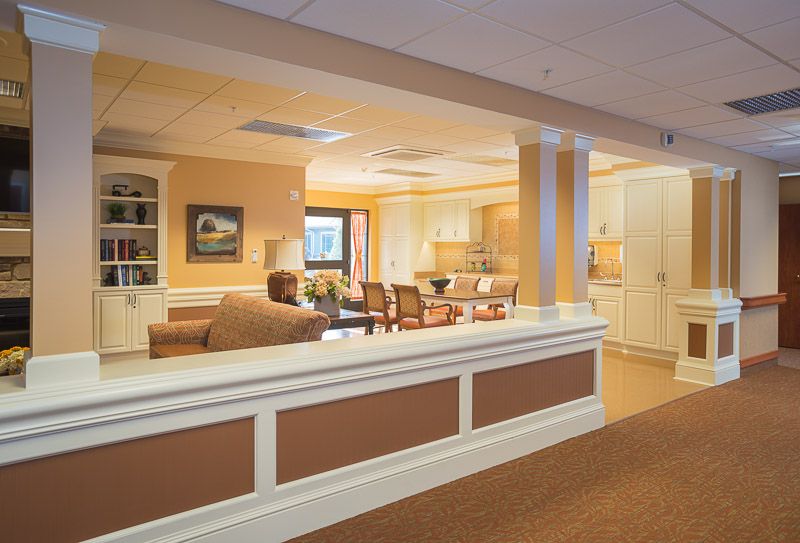 A cozy and warmly lit living room with comfortable seating and tasteful decor.