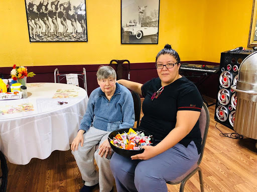 A warm moment shared between two friends, showcasing a beautiful arrangement of food.