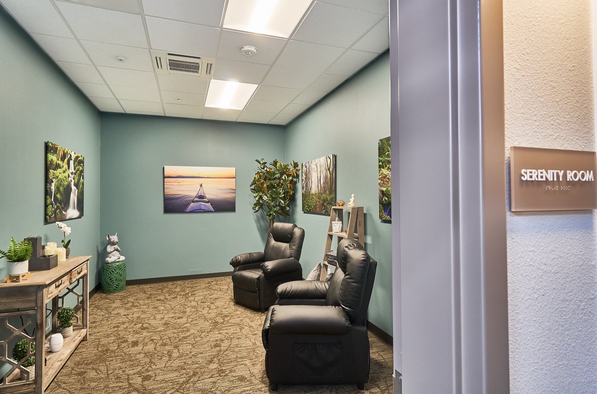 A cozy waiting room with comfortable chairs and soothing decor.