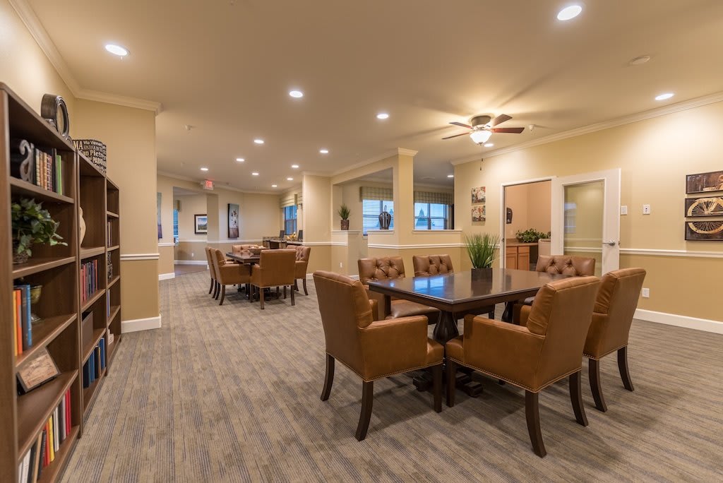 A spacious dining area with comfortable seating and warm lighting.