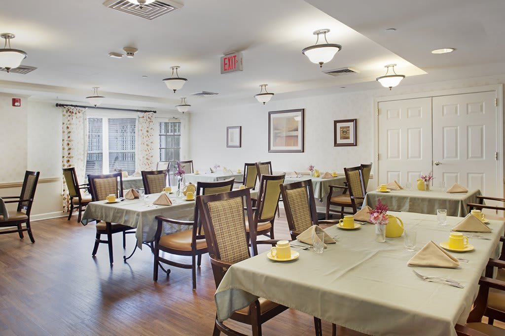 An inviting dining room with neatly arranged tables and chairs, ready for guests.