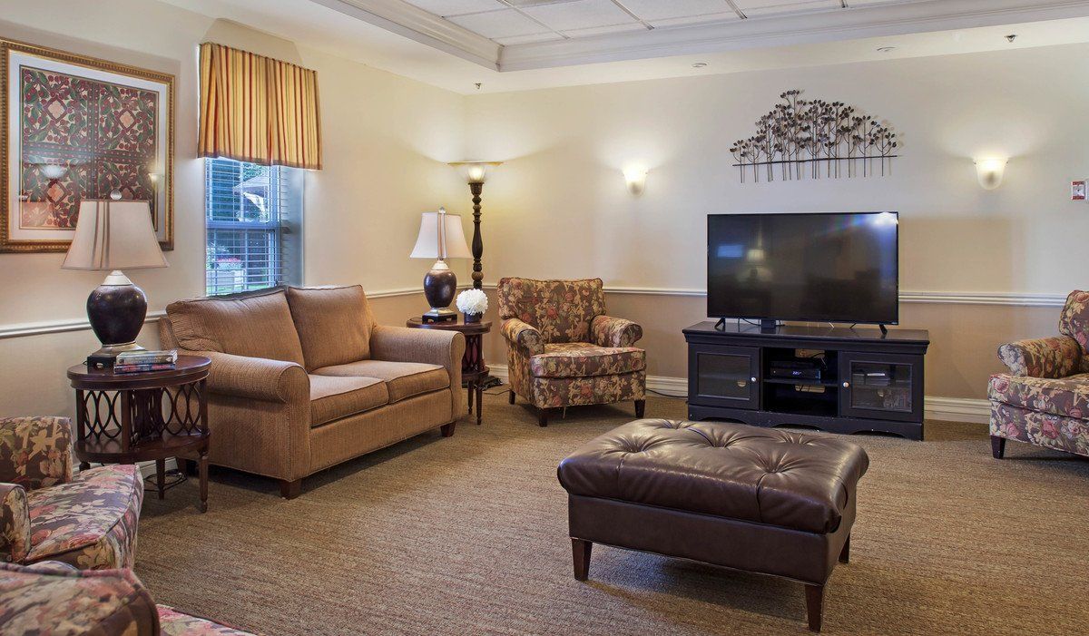 A cozy living room with comfortable seating and a television.