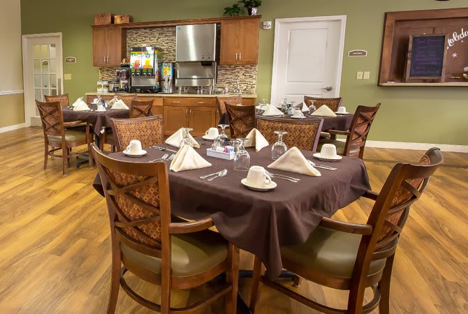 Elegant dining area with neatly arranged tables and chairs.