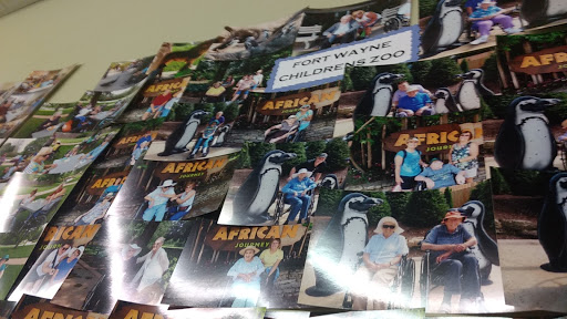 A collage of photographs showcasing visitors enjoying their time at a zoo with a focus on African wildlife.