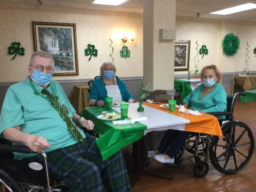 Residents celebrate St. Patrick's Day with festive decorations and themed attire.