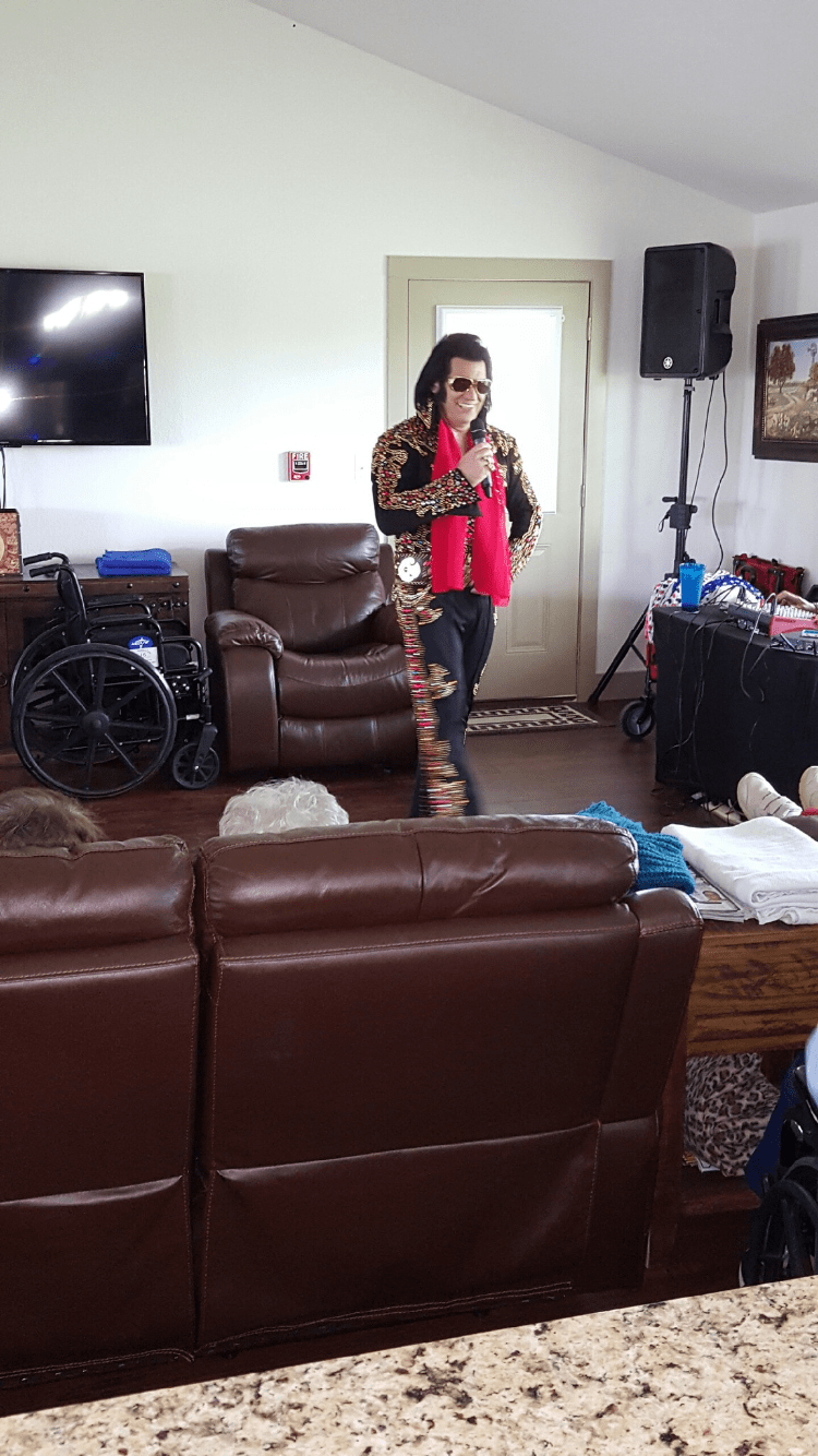 An entertainer performing indoors for an audience.