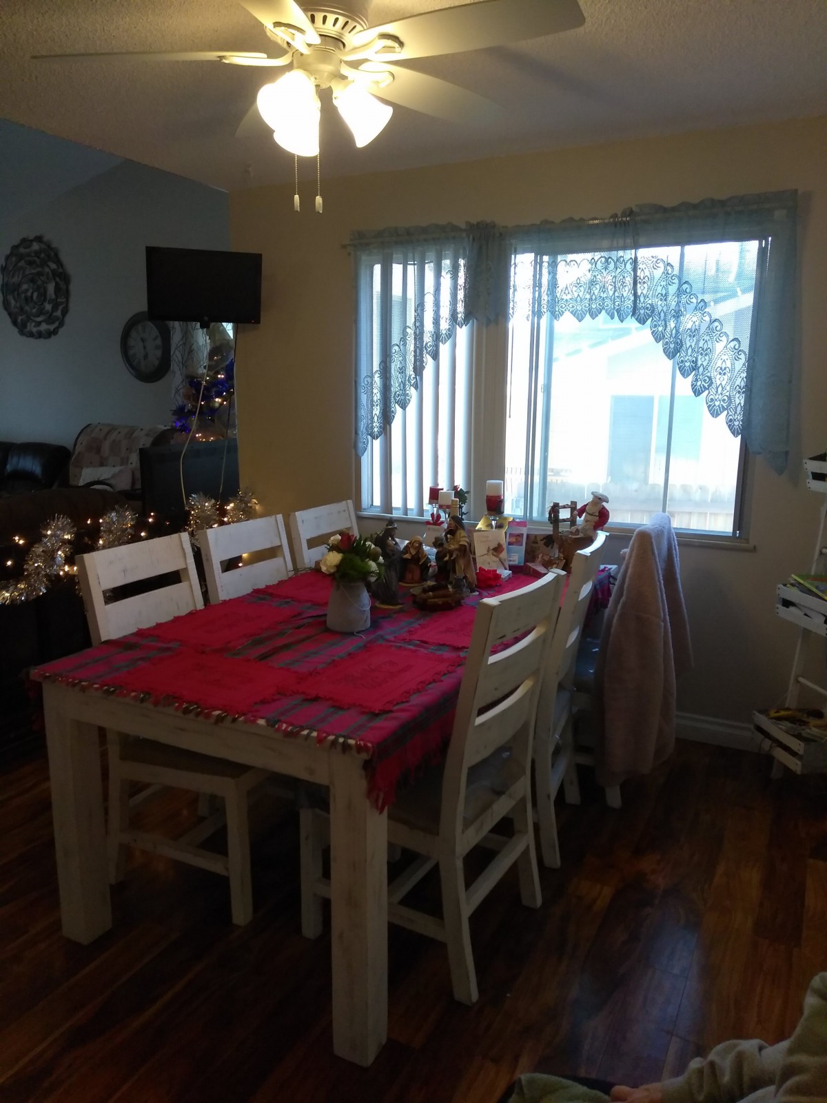 A dining room with a decorated table set for an occasion.