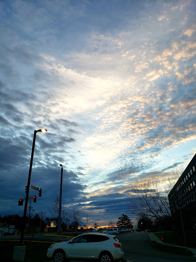 A beautiful blend of clouds and colors in the evening sky over the city.