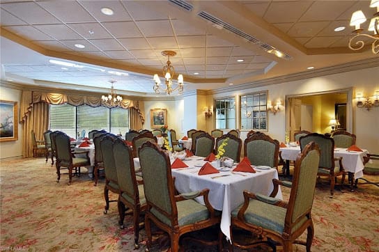 A beautifully set dining room with elegant decor and formal table settings.