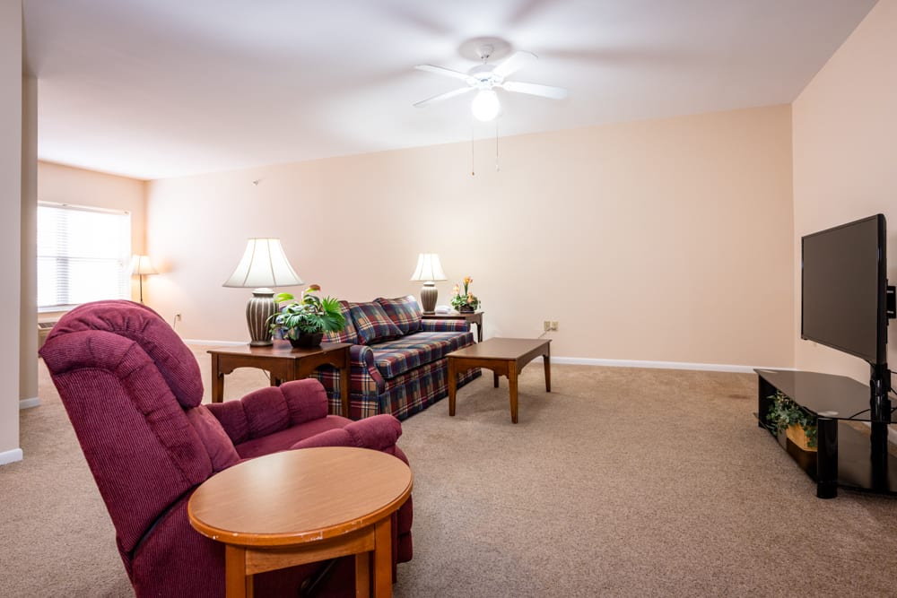 A cozy living room with comfortable seating and warm lighting.