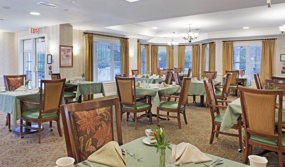 A well-decorated dining room with tables and chairs ready for guests.
