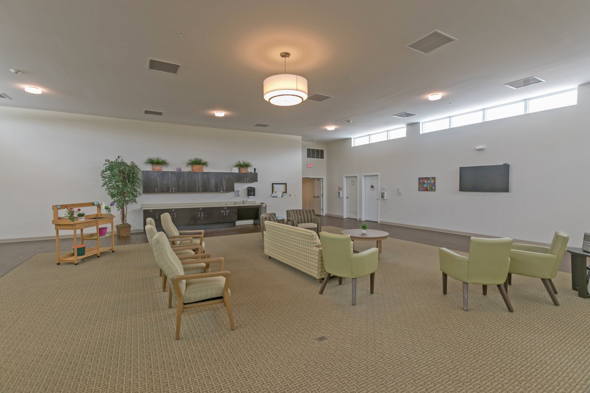 A spacious and modern lobby with comfortable seating arrangements and soft lighting.