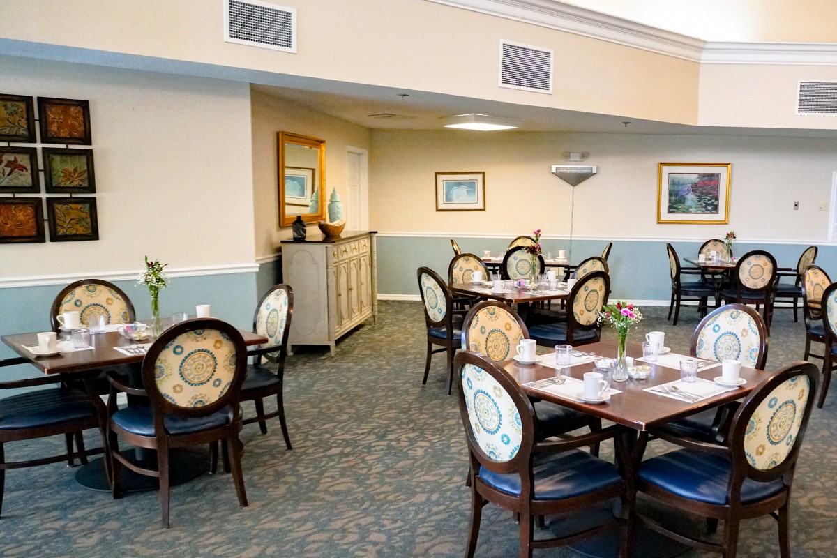 A well-decorated restaurant dining area with neatly arranged tables and chairs.