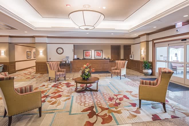 A spacious hotel lobby with comfortable seating and elegant decor.