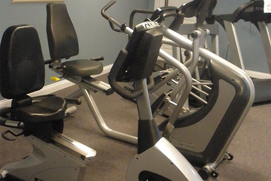 A gym with stationary bikes and other exercise equipment.