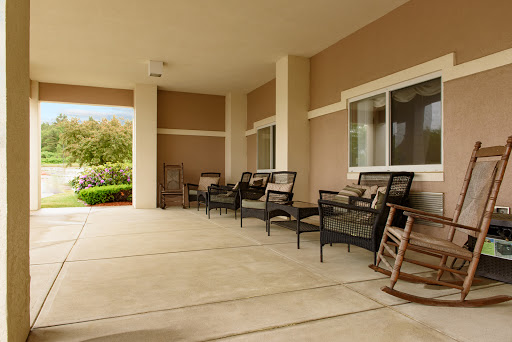 A serene outdoor patio area equipped with comfortable chairs, perfect for relaxation.