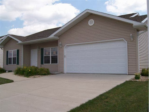 A single-story house with a garage and well-maintained front yard.