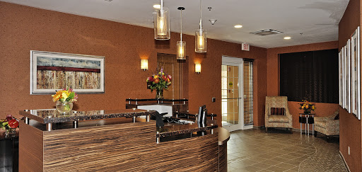 A welcoming modern reception area featuring stylish decor and lighting.