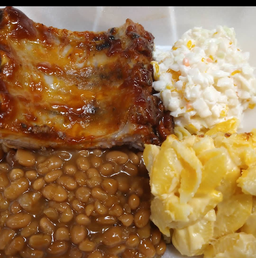 A hearty plate featuring a delicious casserole, baked beans, and creamy macaroni and cheese.