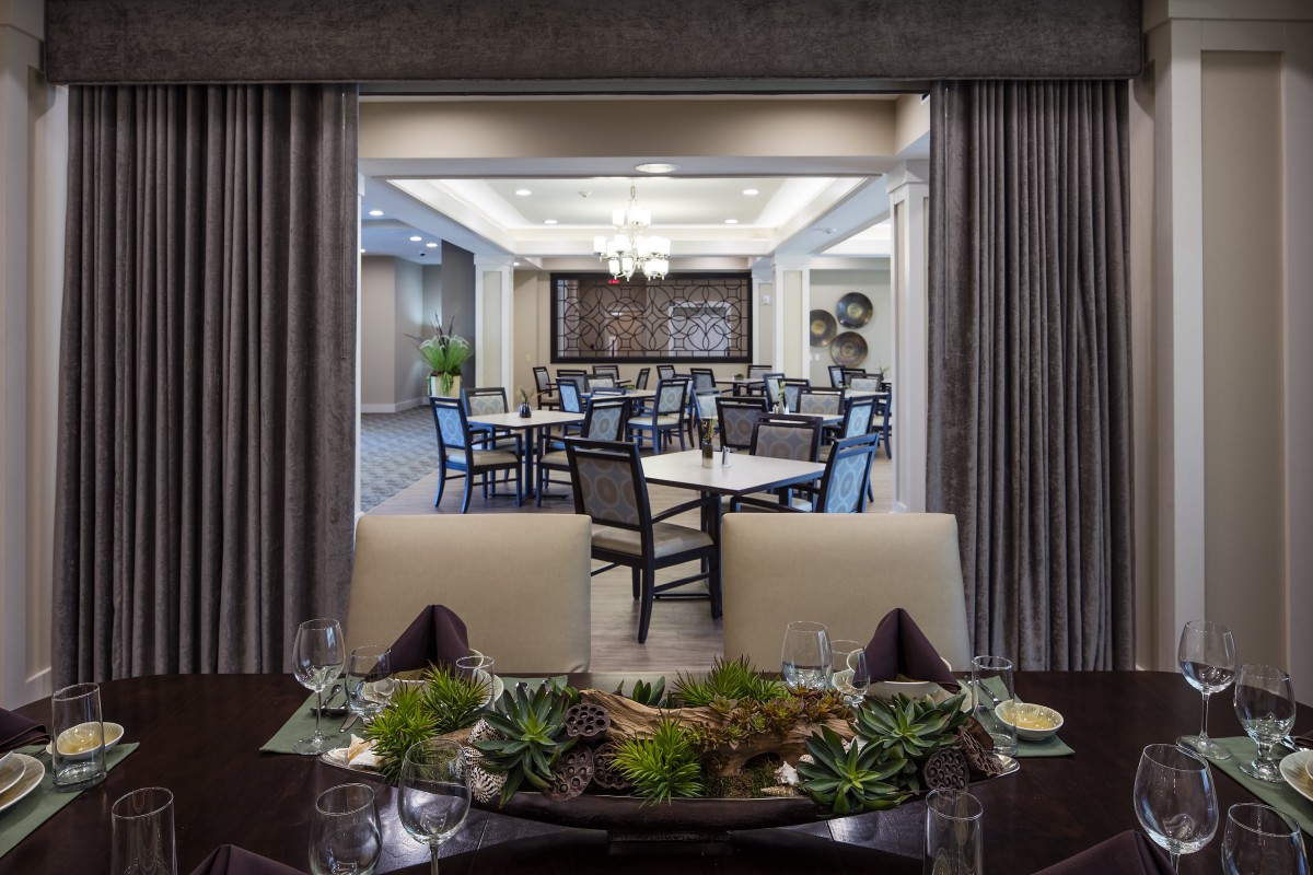 A modern and elegant dining area with stylish decor and seating arrangement.