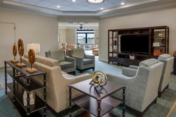 A modern living room with comfortable seating and stylish decor.