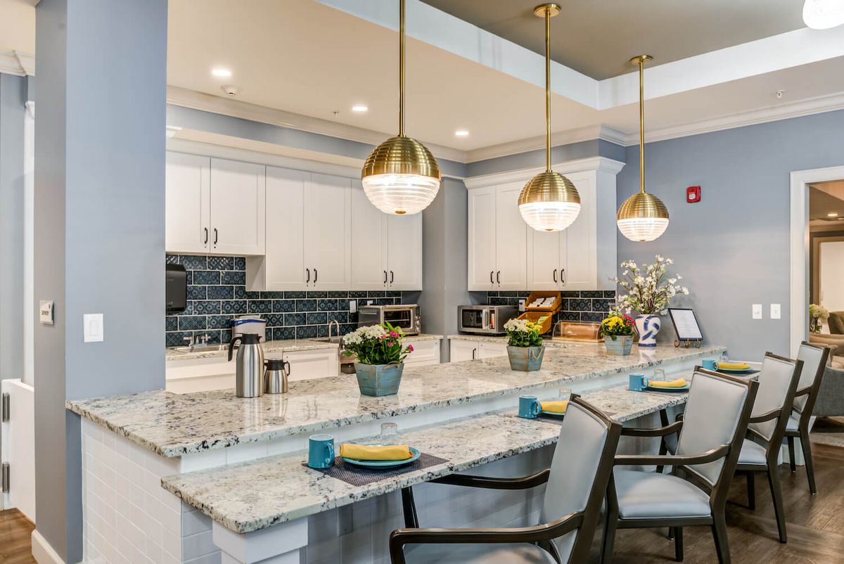 Modern kitchen with pendant lighting and a spacious countertop area.