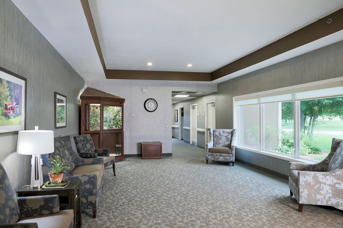 A well-lit lobby with comfortable seating arrangements and large windows.