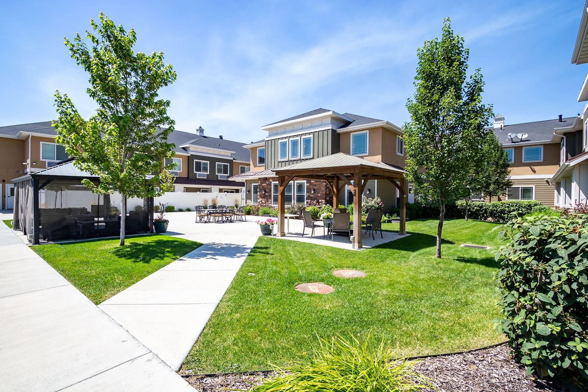 A beautiful backyard with a gazebo on a sunny day.
