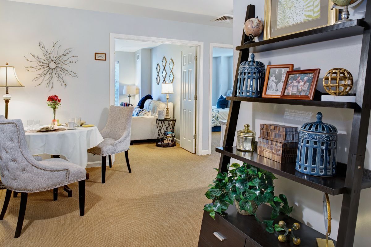 A cozy living room with a dining area featuring modern decor and stylish furniture.