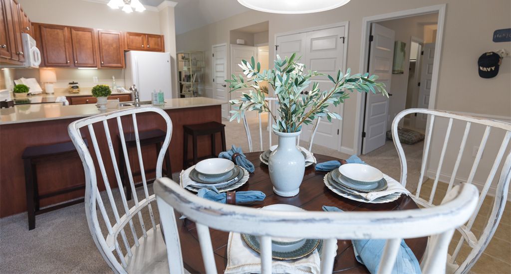 Beautifully set dining table in a cozy kitchen with elegant decor.