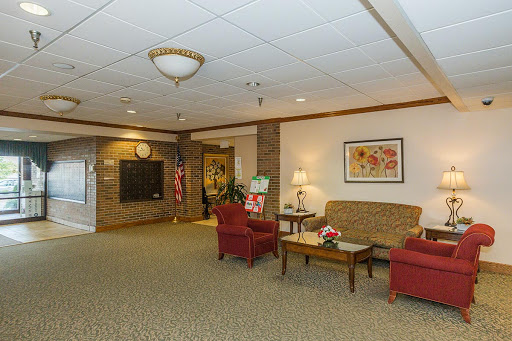 A cozy lobby area featuring comfortable seating and decorative elements.