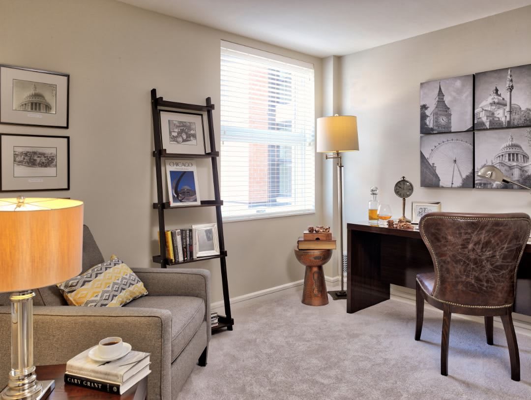 A cozy home office space with a desk, chair, and modern decor.