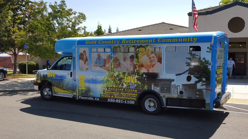 A service van with a full advertisement wrap promoting an irrigation company.