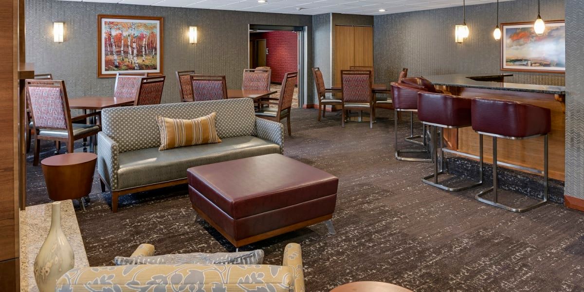A cozy lounge area with comfortable seating and elegant decor.