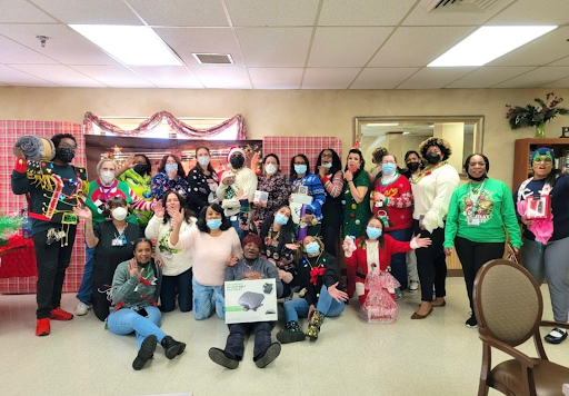 A cheerful gathering celebrating the holiday season with festive attire and a sense of community.