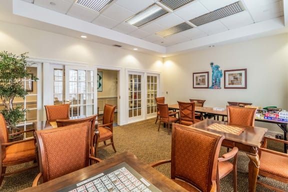 A spacious community room with tables and chairs for gatherings.