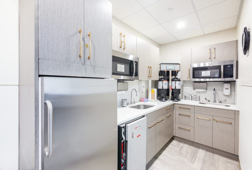 Modern kitchen with sleek appliances and ample storage space.