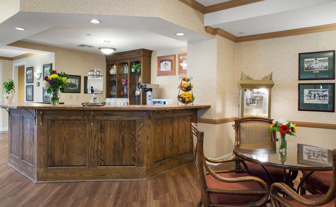 A cozy reception area with wooden furnishings and comfortable seating.