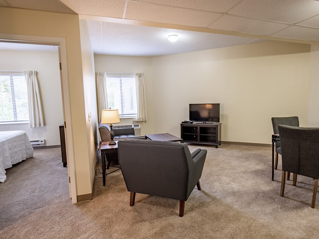 A cozy living room with comfortable seating and a television.
