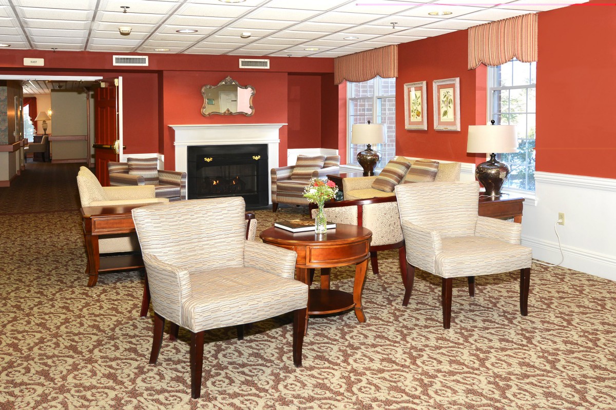 Cozy living room with elegant furnishings and a warm color scheme.
