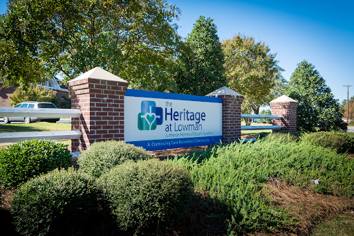 Welcome to Heritage at Lousiville - a community space surrounded by lush greenery.
