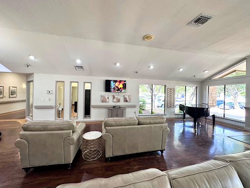 A bright and spacious living room featuring modern furnishings and a cozy ambiance.