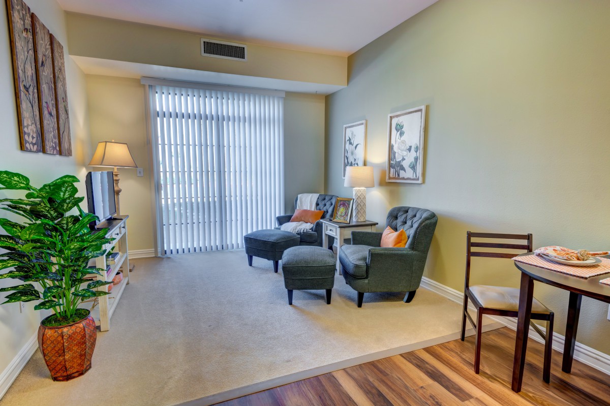 A cozy living room with comfortable armchairs and soft lighting.