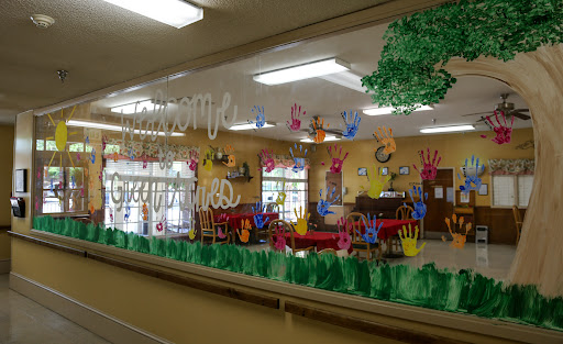 A vibrant classroom filled with children's artwork and creative decorations.