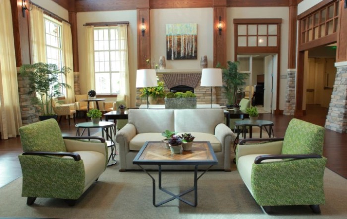 A well-lit living room featuring comfortable seating, elegant furniture, and tasteful decor.