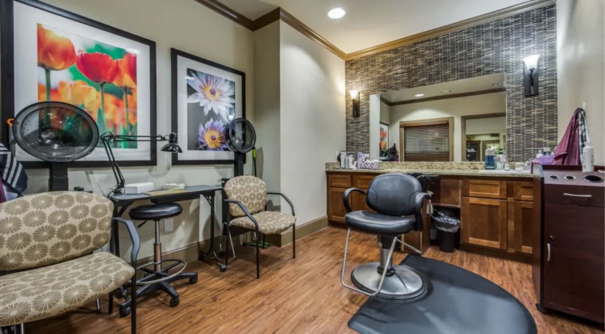 A modern hair salon interior with stylish decor and professional equipment.