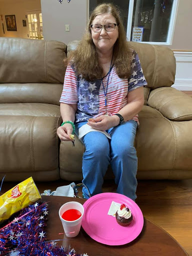 Enjoying a sweet treat on the couch.