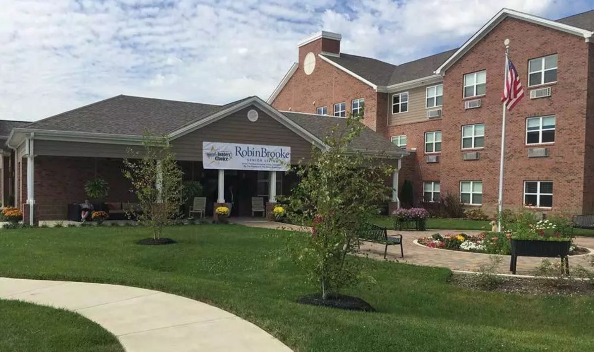 A residential building with a welcoming entrance and landscaped surroundings.