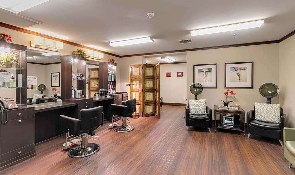 A well-organized hair salon with styling stations and comfortable seating.