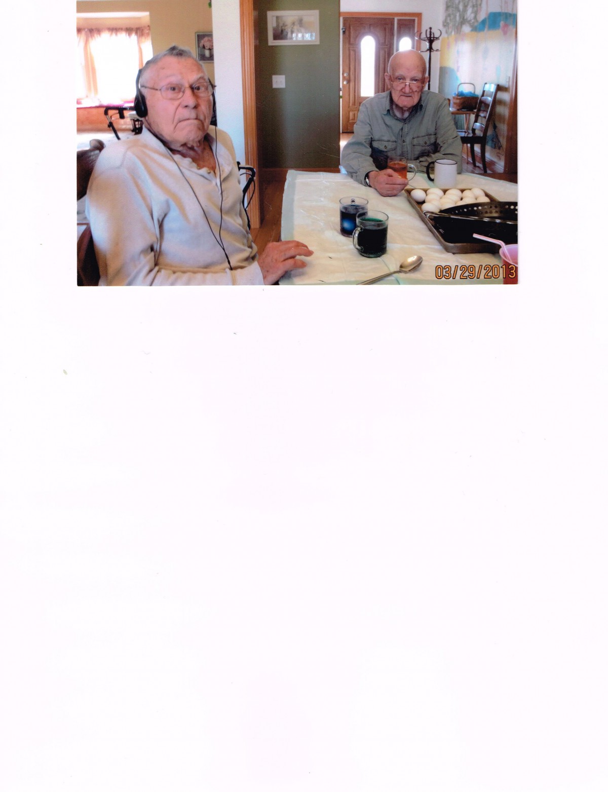 Two people seated at a restaurant table enjoying their meal.